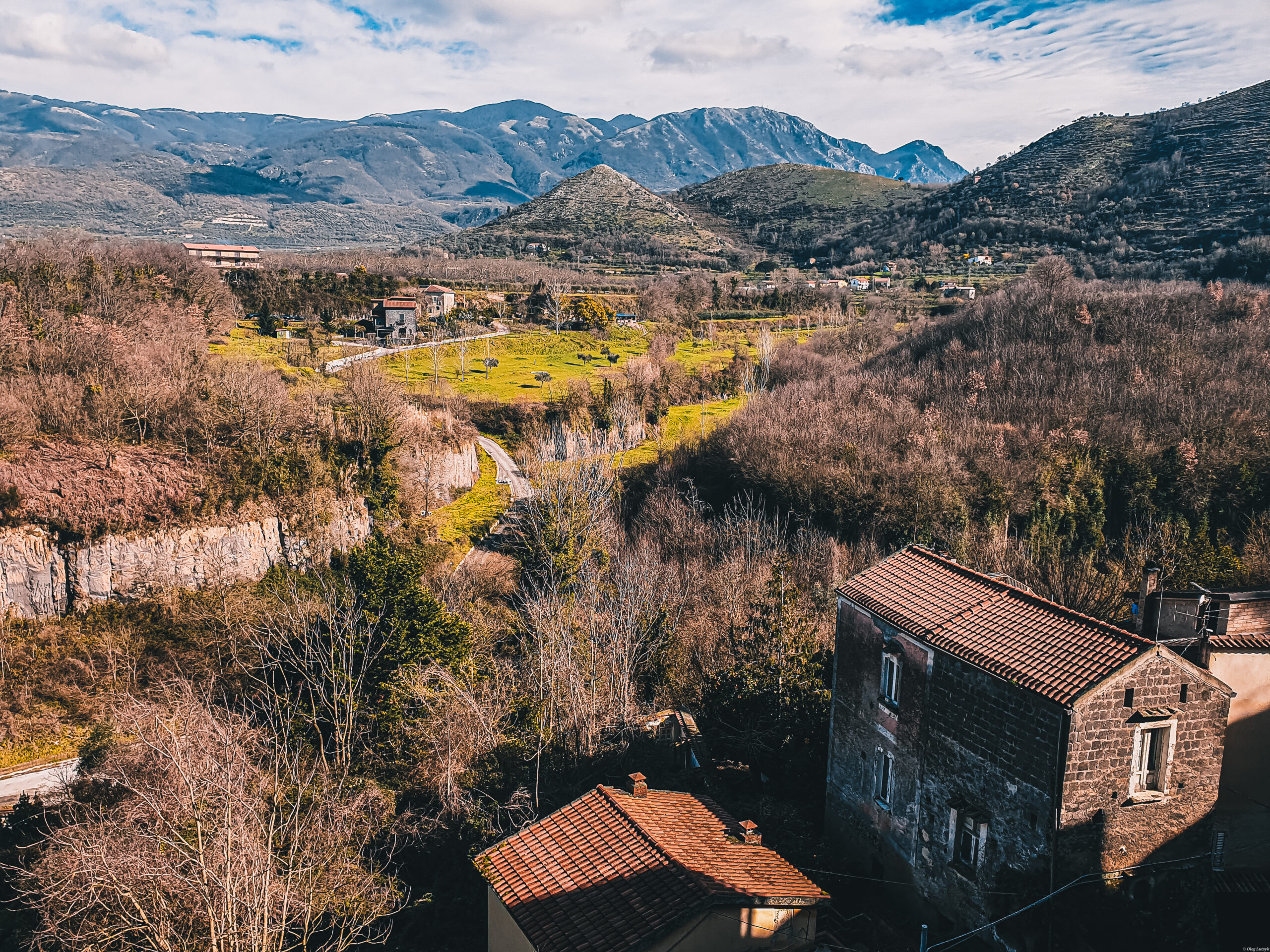 aerial-view-buildings-mountains-against-sky